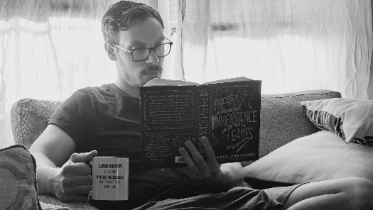 elementary librarian reading a book